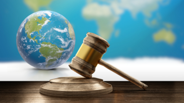 World map, earth globe and wooden judge gavel